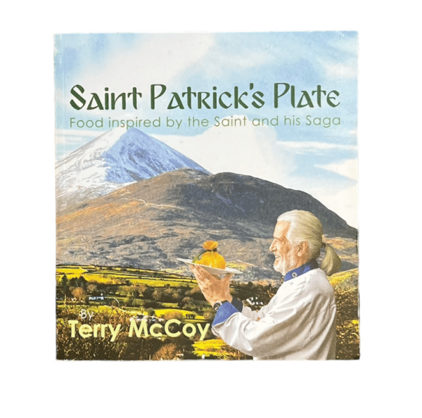 alt= Irish cookbook with man holding plate in front of mountains with a blue sky on a white background