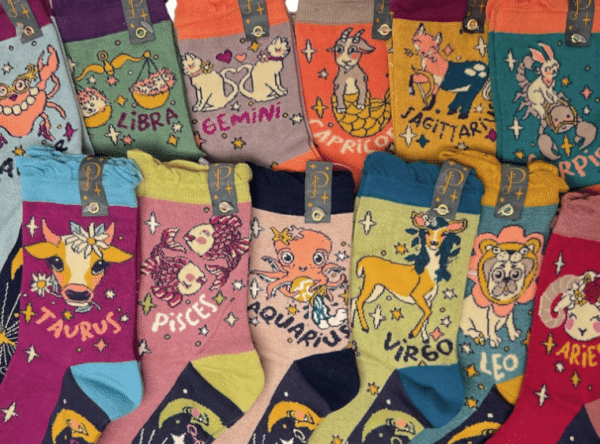 alt= a collection of colorful powder socks depicting the zodiac signs