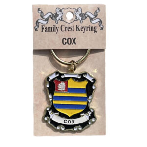 alt= a family crest keychain depicting the Cox family crest on a white background
