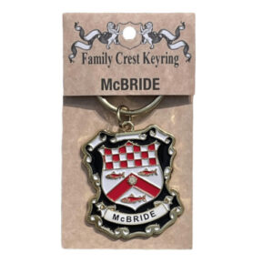 alt= a family crest key chain depicting the family crest of the McBride family crest on a white background