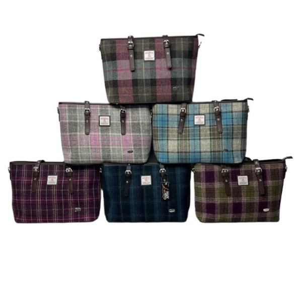 alt= collection of six harris tweed bags with varying colors on a white background