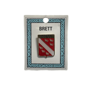 alt= a family crest pin depicting the Brett family crest