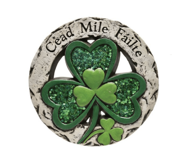 alt= a clover garden ornament with a celtic phrase on it with a white background