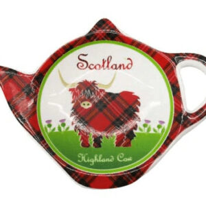 alt= a red and black tartan teabag holder shaped like a teapot with a stylized highland cow