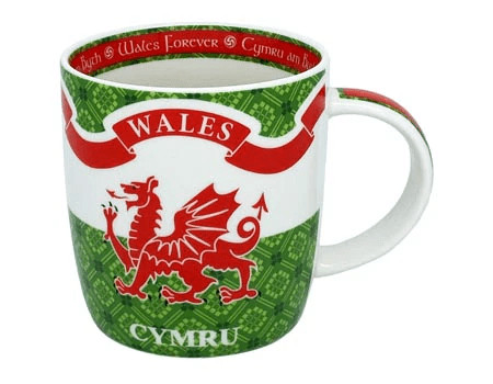 alt= a ceramic mug depicting the Welsh flag and the word Wales on it with red and green trim