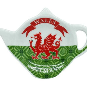 alt= a teabag holder designed to look like the Welsh flag with the word Whales on it shaped like a teapot