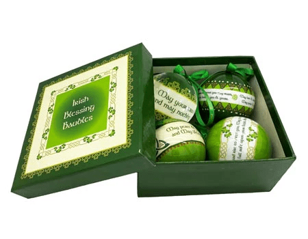 alt= a gift set of four green and white ornament bauble depicting a shamrock and the word Ireland