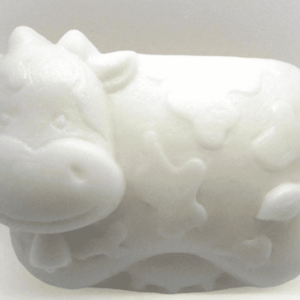 alt= cute cow made of soap sitting on a white background