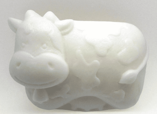 alt= cute cow made of soap sitting on a white background