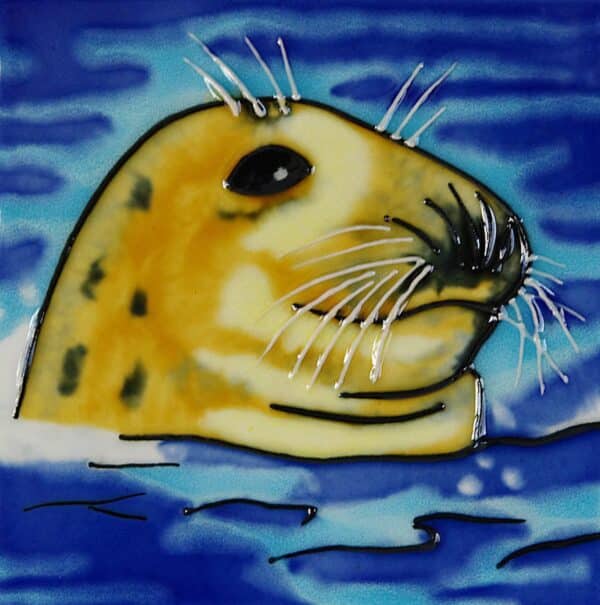 alt= a wall tile depicting a cute seal poking its head through deep blue water