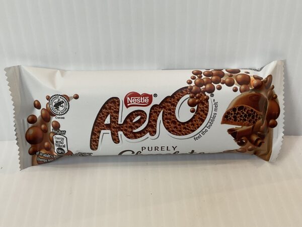 Aero Milk 36g in pure white packaging with rich brown bubbles; evokes Scottish tradition, celebrating chocolates melting magic.