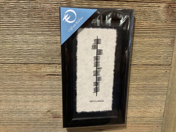 Irish Ogham Resilience 11x6: Framed, textured backdrop, Rest Well label; green hues, Celtic knots; plastic-wrapped on wood wall.