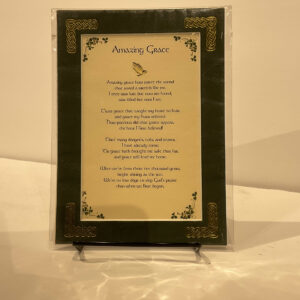 Framed Scottish Amazing Grace 5x7 poem on black stand, featuring Celtic knotwork in vibrant greens and golds against a beige backdrop.