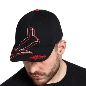 Irish man in black cotton cap, featuring red and white abstract toucan motif—a nod to Celtic symbolism and playful heritage.