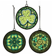 Set of three Irish glass ornaments, each featuring vivid green shamrocks and intricate Celtic knotwork stained designs.