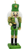 Irish-inspired nutcracker with Celtic knotwork, green and gold livery, white hair and beard, standing on a detailed green base.