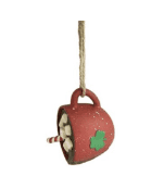 Irish-inspired ornament: A glossy red ceramic mug with a green shamrock, topped with marshmallows and a candy cane, hangs festively.