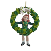 Irish dancer ornament: Girl in green Irish dance dress within shamrock wreath, white bow; celebrates Celtic heritage and tradition.