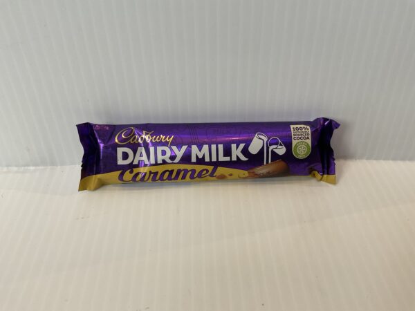 Irish Cadbury Caramel Bar, 45g; rich purple and gold foil, classic Celtic-inspired swirls; a beloved chocolate indulgence.