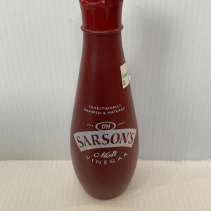 Traditional English Sarson’s Malt Vinegar in a classic red plastic bottle with flip-top cap, prized for hearty British cooking.