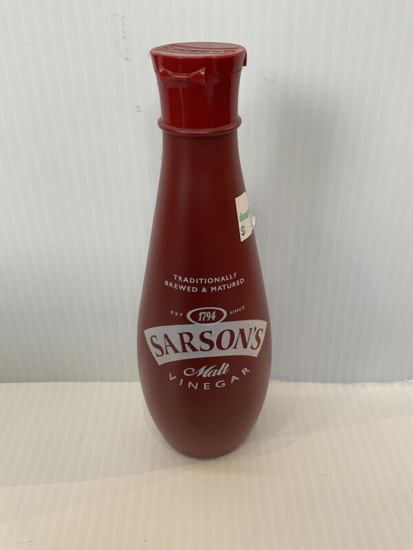 Traditional English Sarson’s Malt Vinegar in a classic red plastic bottle with flip-top cap, prized for hearty British cooking.