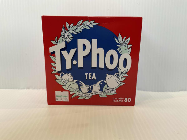Authentic British Typhoo Tea box, vivid red with a blue circle and white teacups; classic blend for hearty, shared teatimes.