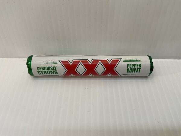 A roll of Scottish XXX Strong Mints, 40.5g, in green tartan packaging with crisp white accents—bold, authentic mint tradition.