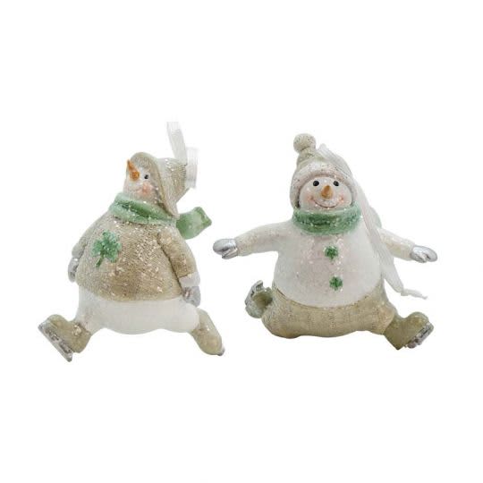 Irish-inspired Snowmen Ornament: Two glittered snowmen in green knit Aran hats and Celtic scarves, seated joyfully, evoke festive tradition.