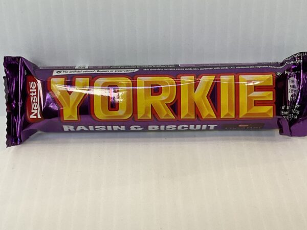 A Nestlé Yorkie Biscuit Raisin bar in a rich purple wrapper, echoing Welsh tradition, evokes hearty Celtic snacking heritage.