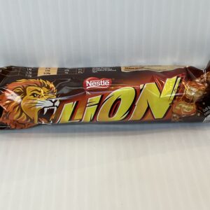 Irish-made 50g Nestlé Lion Bar in bold gold wrapper, featuring a roaring lion—symbol of strength in Celtic lore; classic snack.