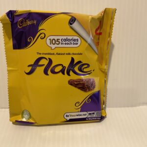Irish Cadbury Flake 4-pack wrapper in radiant yellow, featuring classic branding and chocolate photo; iconic teatime treat.