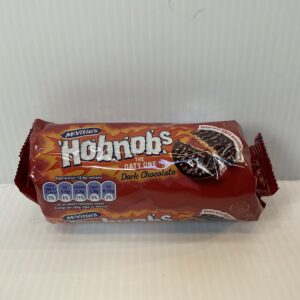 McVitie’s Hobnobs Dark Chocolate 262g pack, Scottish-made oat biscuits in iconic blue tartan design, symbolizing heritage.