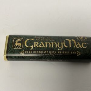 Irish-inspired GrannyMac Choc Whiskey Bar, 50g; rich green-gold Celtic knot motif evokes heritage and artisan chocolate craft.